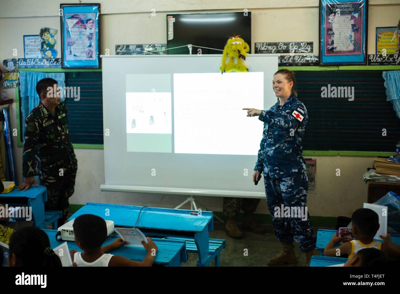 Australian Navy Flight Lt. Victoria Love-Rainbow gives a class on basic hygiene at Pagasa Elementary School in Pagasa, Bataan, Philippines, during a cooperative health engagement as a part of Exercise Balikatan, April 8, 2019. There are numerous humanitarian and civic action projects scheduled during Balikatan. Combined Philippine-U.S. medical and dental teams will provide medical and dental subject matter expert exchanges in various locations throughout the island of Luzon. Love-Rainbow, a native of Parkes, New South Wales, Australia, is an environmental health officer with No. 1 Expeditionar Stock Photo