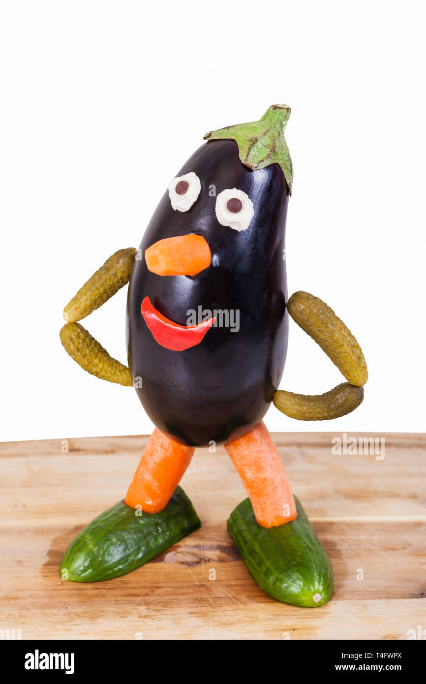 Funny figure carved out of an eggplant - isolated Stock Photo