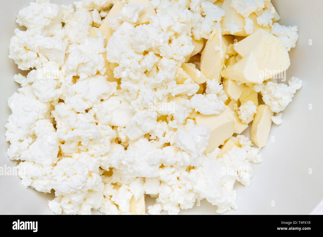 In A Mixing Bowl Are The Ingredients Butter And Cottage Cheese For