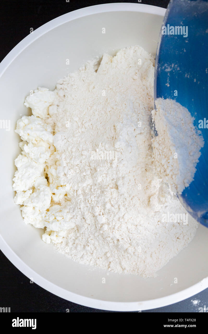 In A Bowl With Ingredients Butter And Cottage Cheese For Biscuits