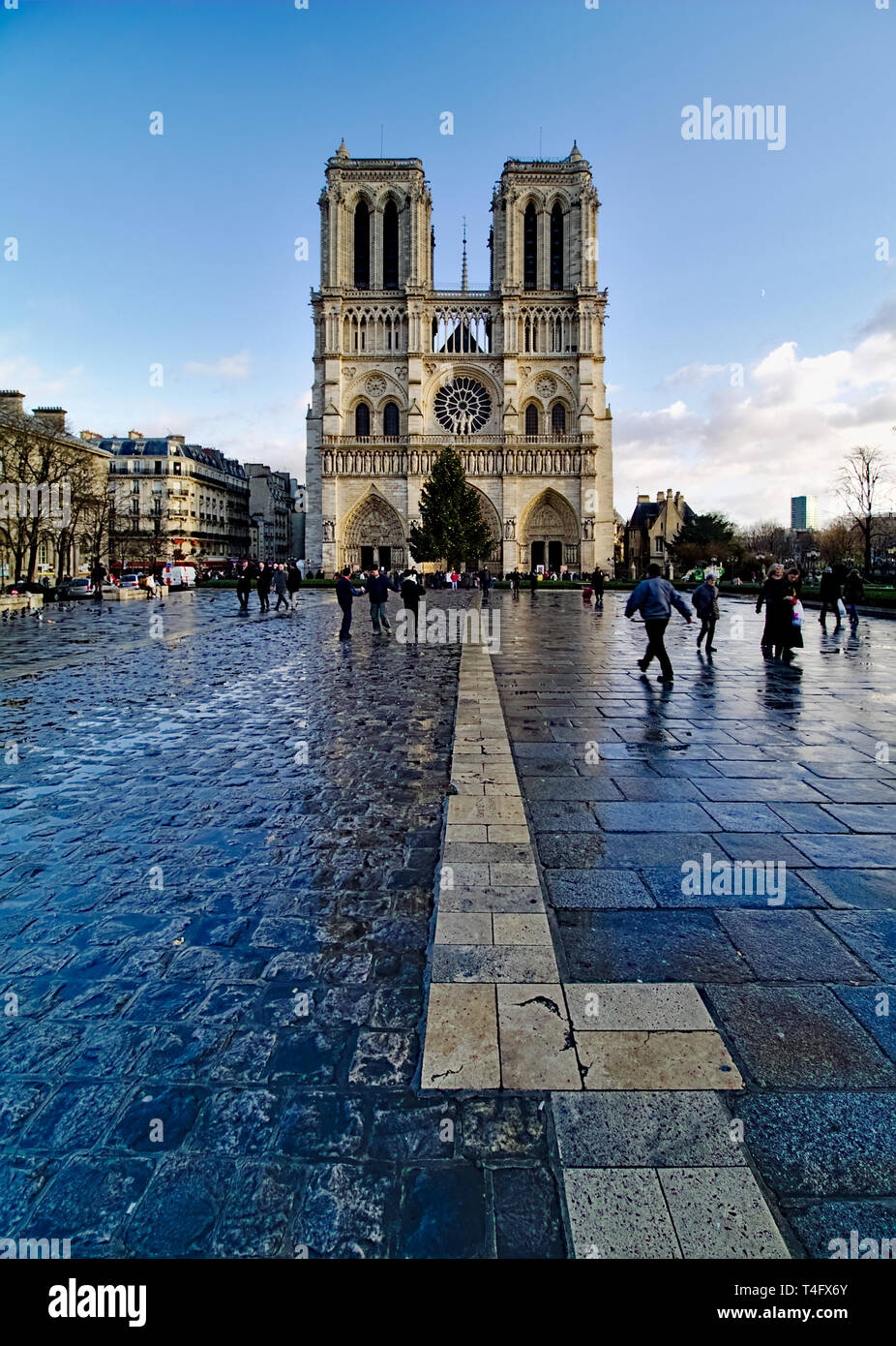 Notre Dame De Paris Cathedral France Winter Blue Sky With Some Clouds