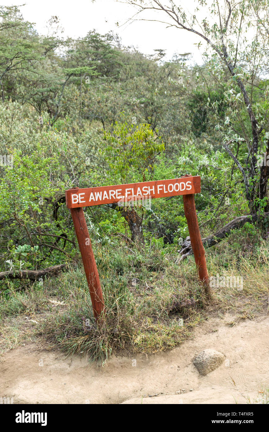 Be aware flash floods sign at Ol Njorowa gorge, Hells Gate National Park, Kenya Stock Photo