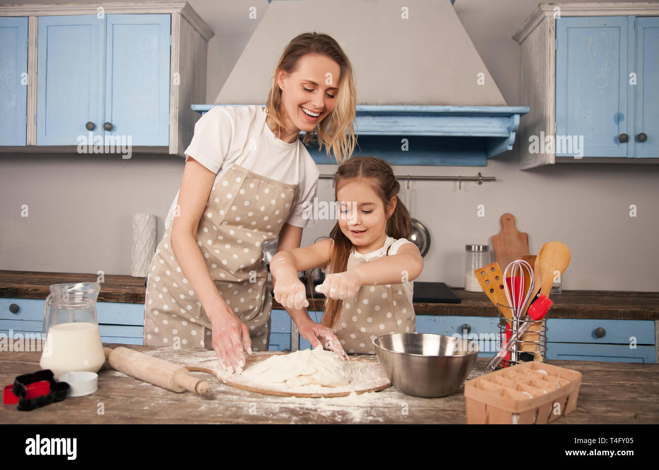 happy loving family is preparing bakery together. Mother and child ...