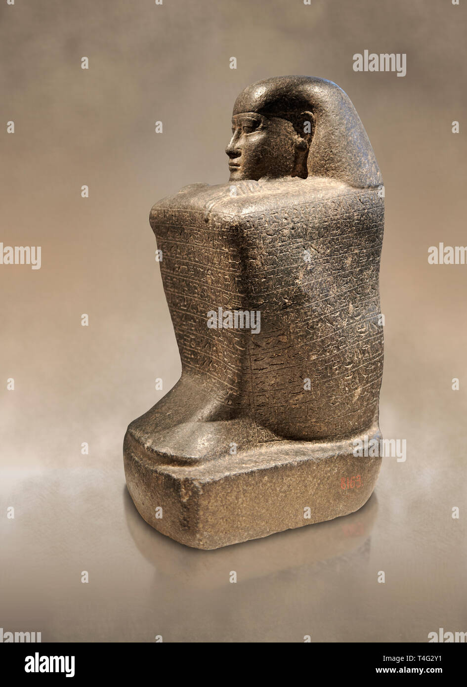 Ancient Egyptian granite block statue of the steward Haruafrom Thebes. 26th Dynasty 500 BC. Neues Museum Berlin AM 8163. Stock Photo