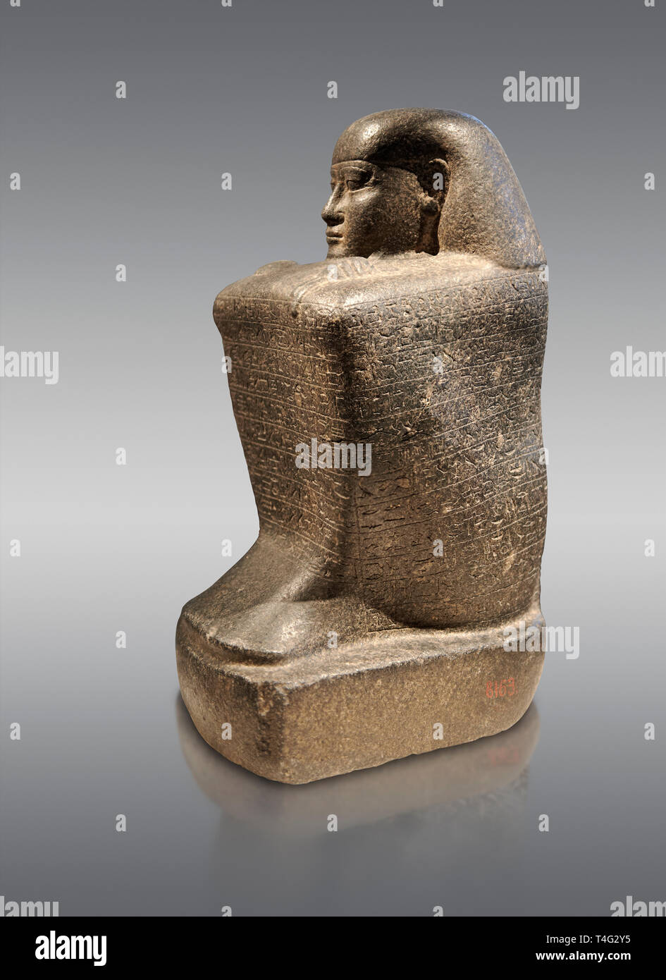 Ancient Egyptian granite block statue of the steward Haruafrom Thebes. 26th Dynasty 500 BC. Neues Museum Berlin AM 8163. Stock Photo