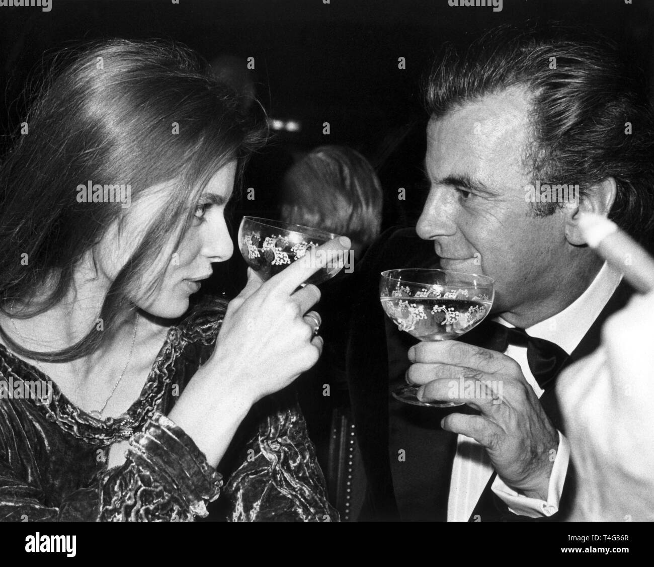 Swiss-Austrian actor Maximilian Schell and German actress Nastassja Kinski look in each other's eyes during the German Film Ball on 19 January 1980 in Munich. | usage worldwide Stock Photo