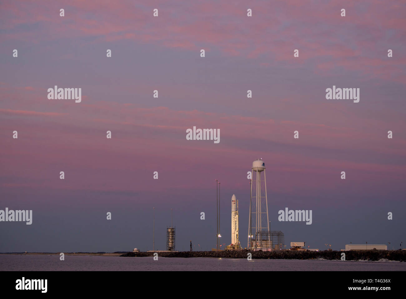 A Northrop Grumman Antares rocket carrying a Cygnus resupply spacecraft is seen during sunrise on Pad-0A, Tuesday, April 16, 2019 in Wallops Island, Va. Northrop Grumman's 11th contracted cargo resupply mission with NASA to the International Space Station will deliver about 7,600 pounds of science and research, crew supplies and vehicle hardware to the orbital laboratory and its crew. (Bill Ingalls/NASA via AP) Stock Photo