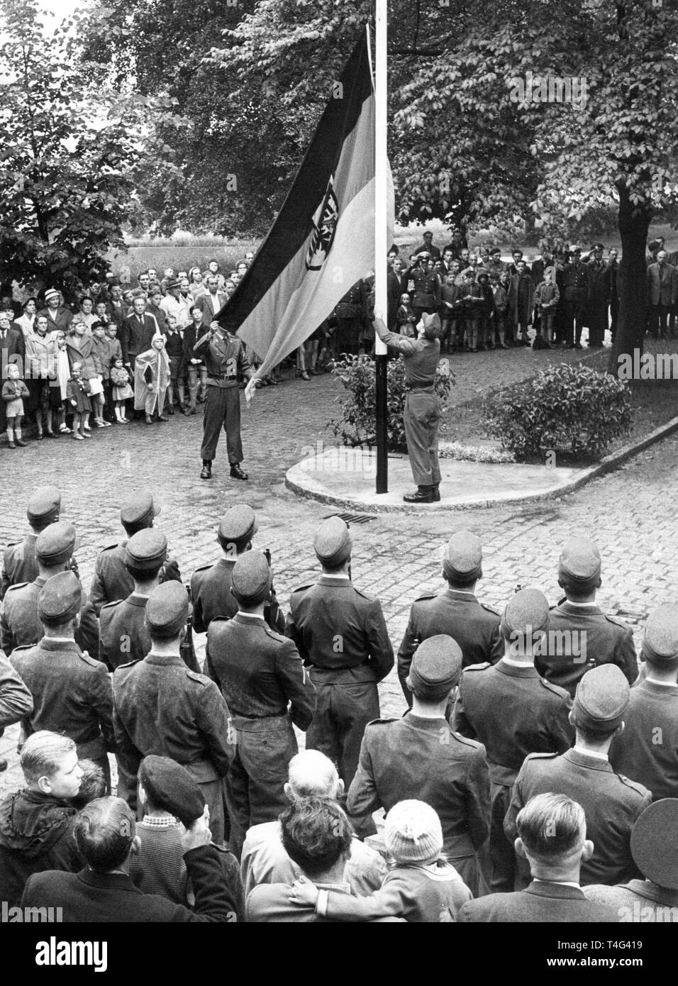 The West German flag was hoisted on 23 July 1956 in Unna - Germany. The  German armed forces - Bundeswehr - took over the barracks after the belgian  troops left. | usage worldwide Stock Photo - Alamy