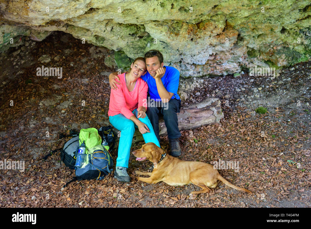 Short break for togetherness in a rock cave Stock Photo