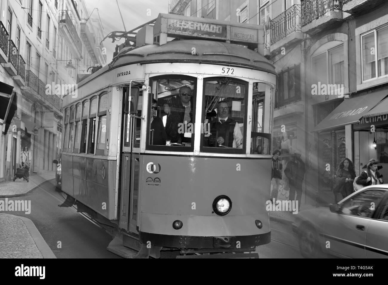 Portugal, Lisbon, Bairro Alto, tram, Electrico, tramway, streetcar, people, architecture, charming, picturesque, nostalgia, nostalgic, public transports in Lisbon, center of Lisbon, sightseeing, discovering Lisbon, travel, tourism, black and white, black a | usage worldwide Stock Photo