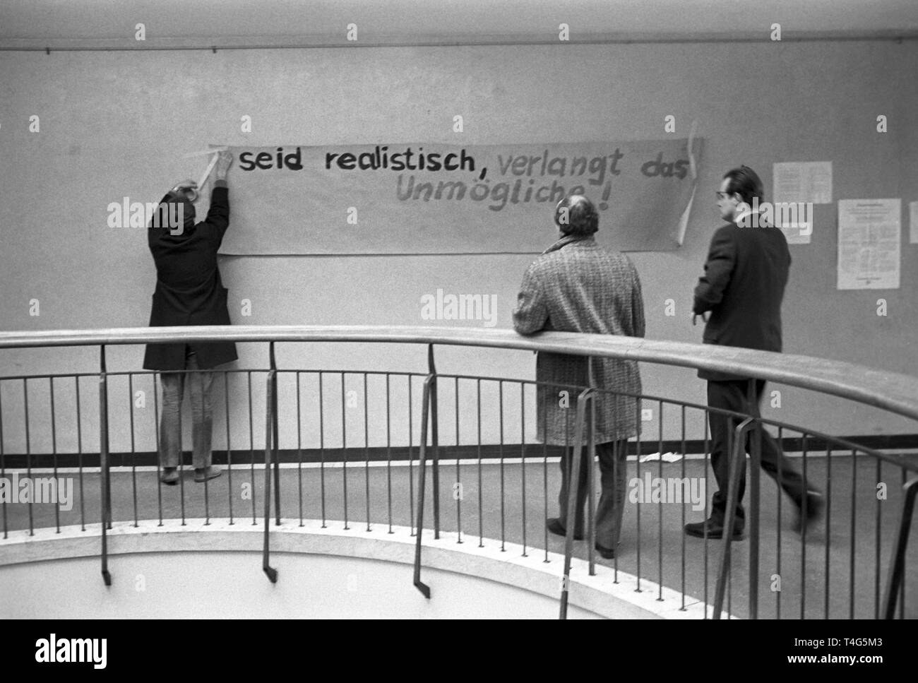 Students put up a banner in the staircase of the institute. The university institute of sciences of journalism in the Amerikahaus in Munich were occupied by students on 11 February 1969. They demanded to gain access to records of director Roegele. | usage worldwide Stock Photo