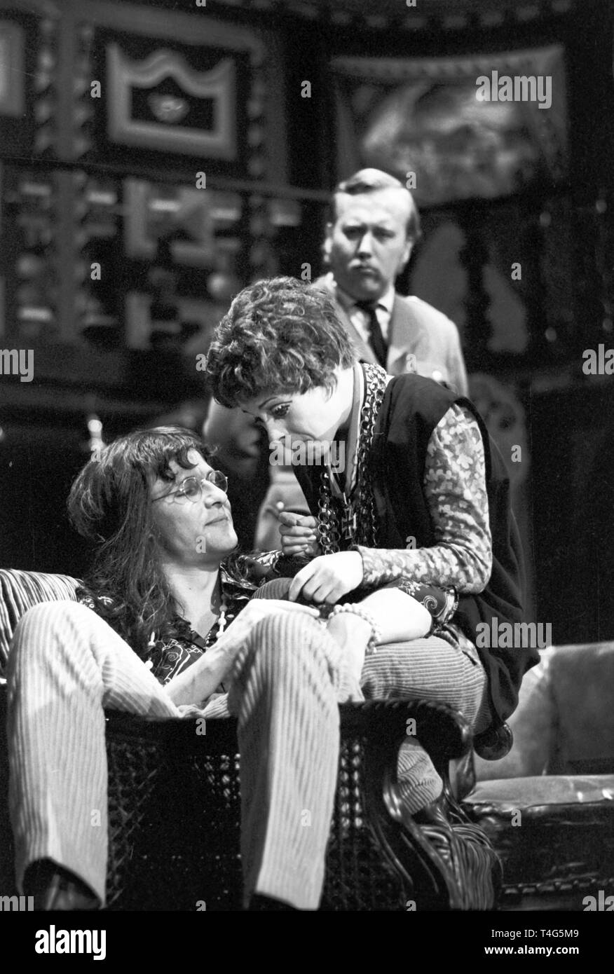 Hans Kordeck and Marie-Agnes Reintgen as hippie couple, Ingo Feder as sceptical observer in the back, photographed during a rehearsal on 09 May 1969. The State Theatre of Baden in Karlsruhe put the word premiere of the play 'Hippie-End' by Karl Heinz Willschrei on stage on 10 May 1969. | usage worldwide Stock Photo