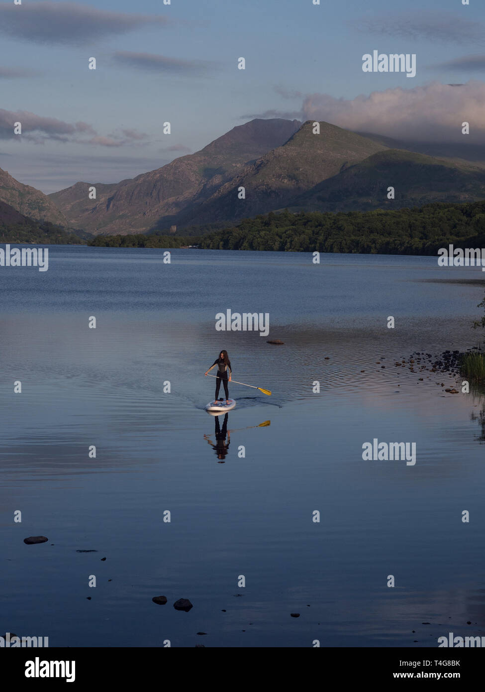 paddle boarding sup on lake in Wales Stock Photo
