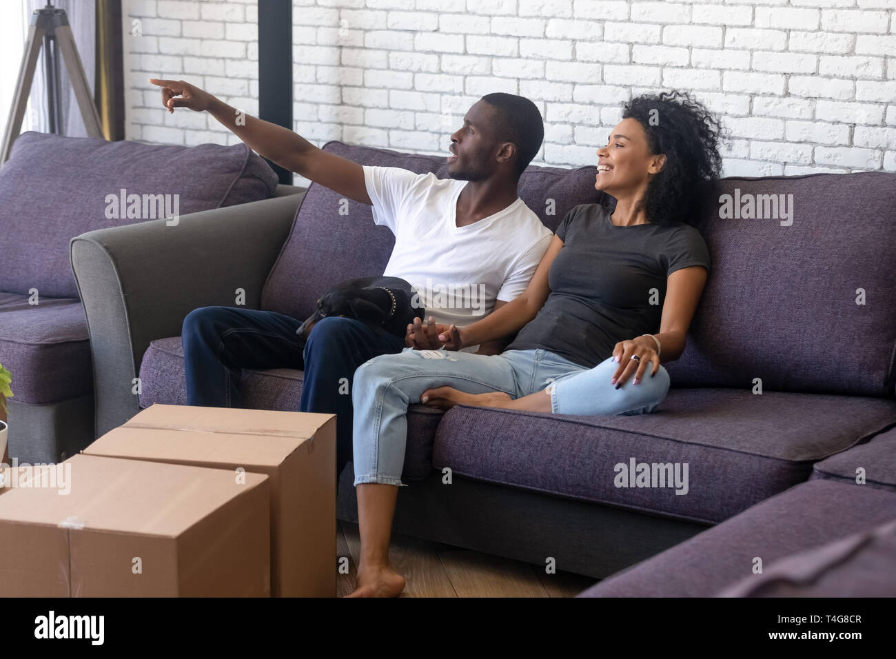 Happy African American couple planning renovation in new house Stock ...