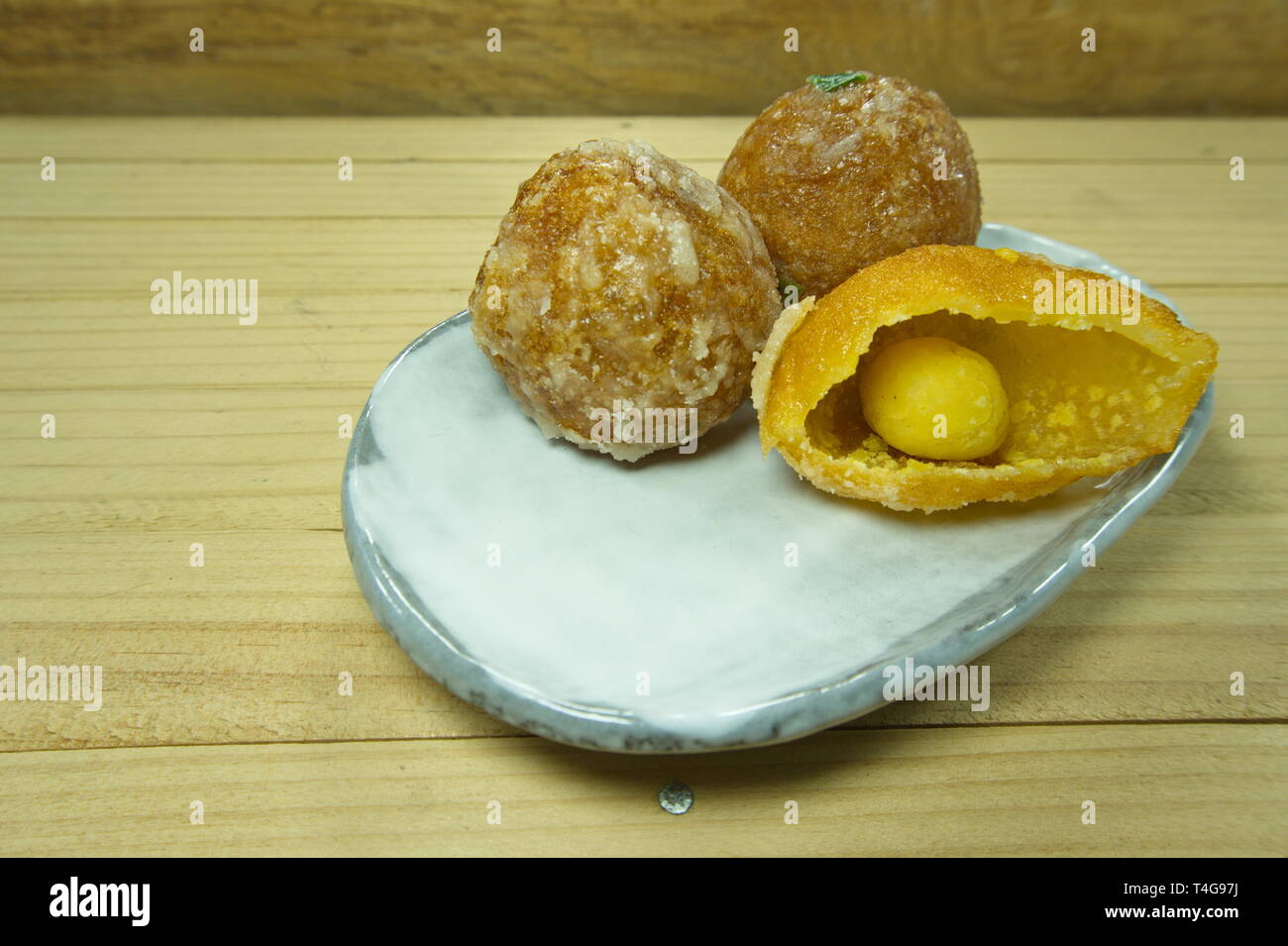 Khai Hong: sugar coating fried mung bean stuffed balls. Thai desserts. Stock Photo