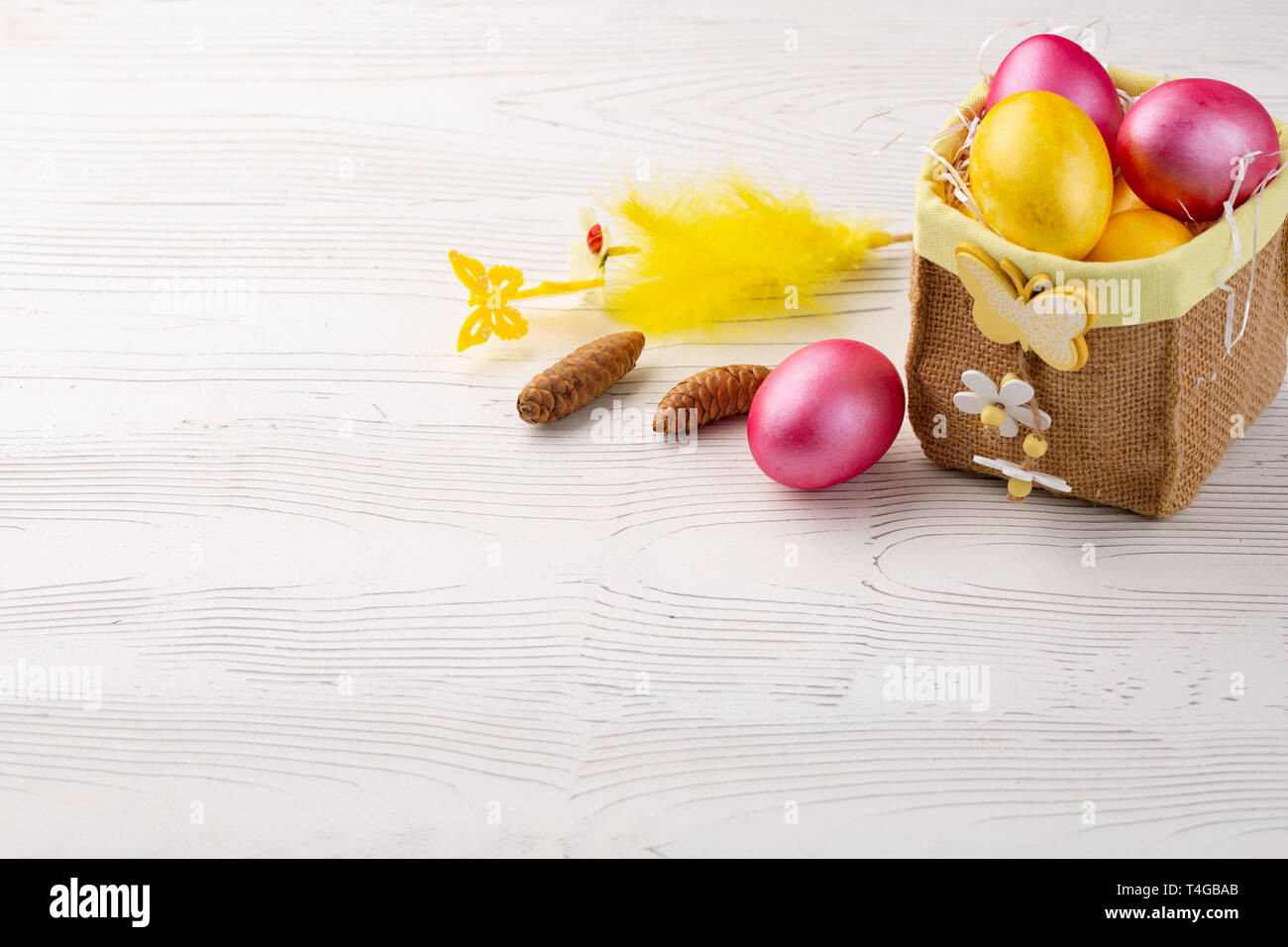 Easter eggs in box on white wooden background, turquoise Easter background Stock Photo