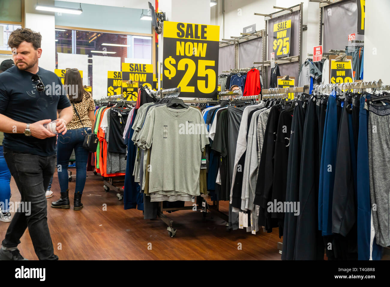 Customers shop for bargains at the Times Square location of the family