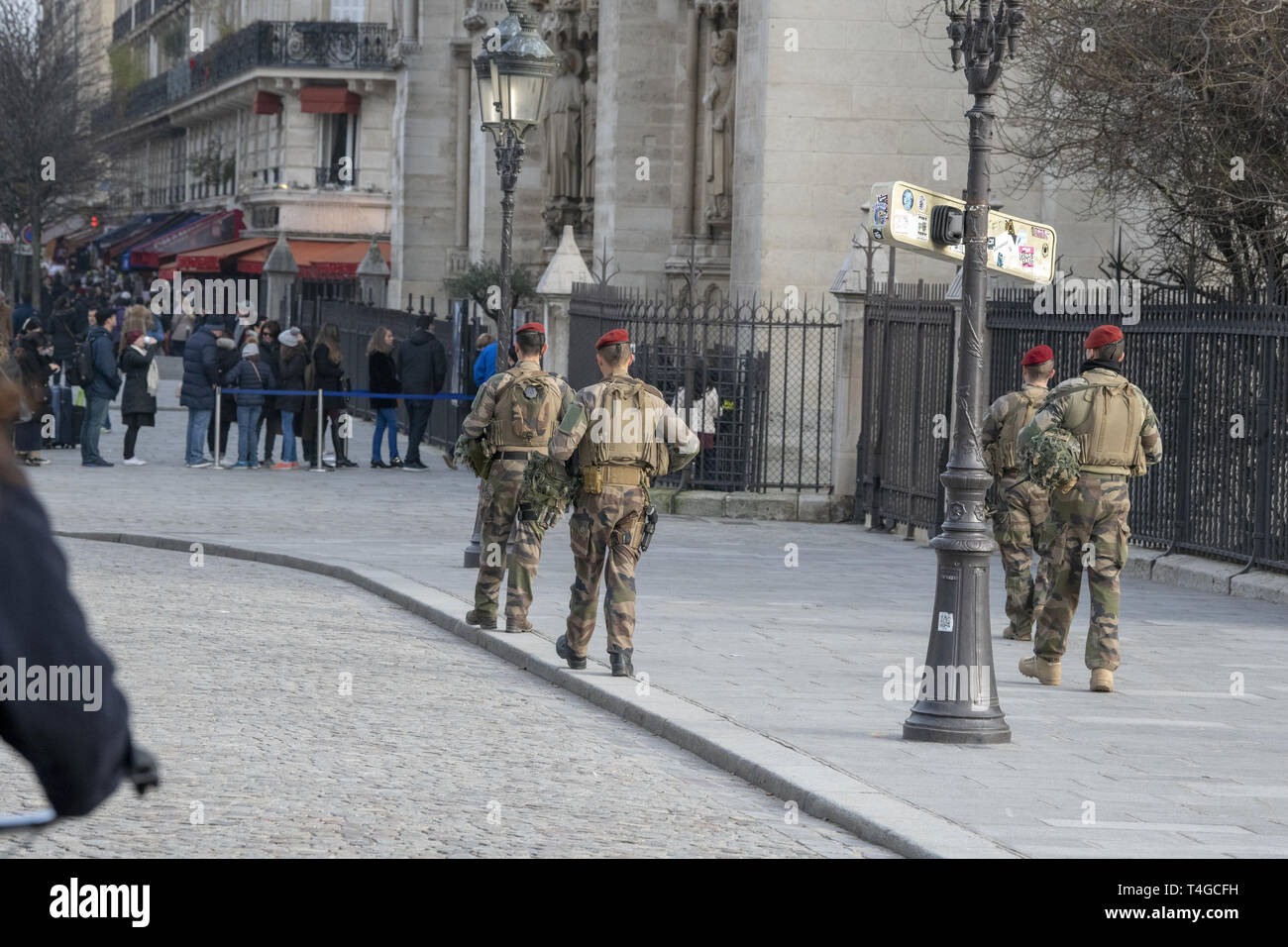 Military personnel patrolling the entrance of Notre Dame de Paris, as part of the Plan Vigipirate ,  France's national security alert system. Stock Photo