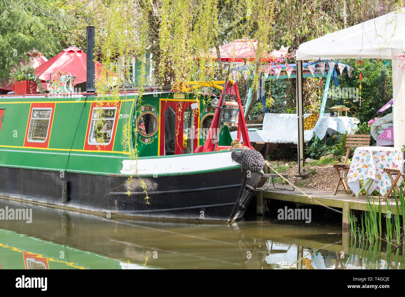 Canal boat alongside Janes Enchanted Tea Garden on the oxford canal on
