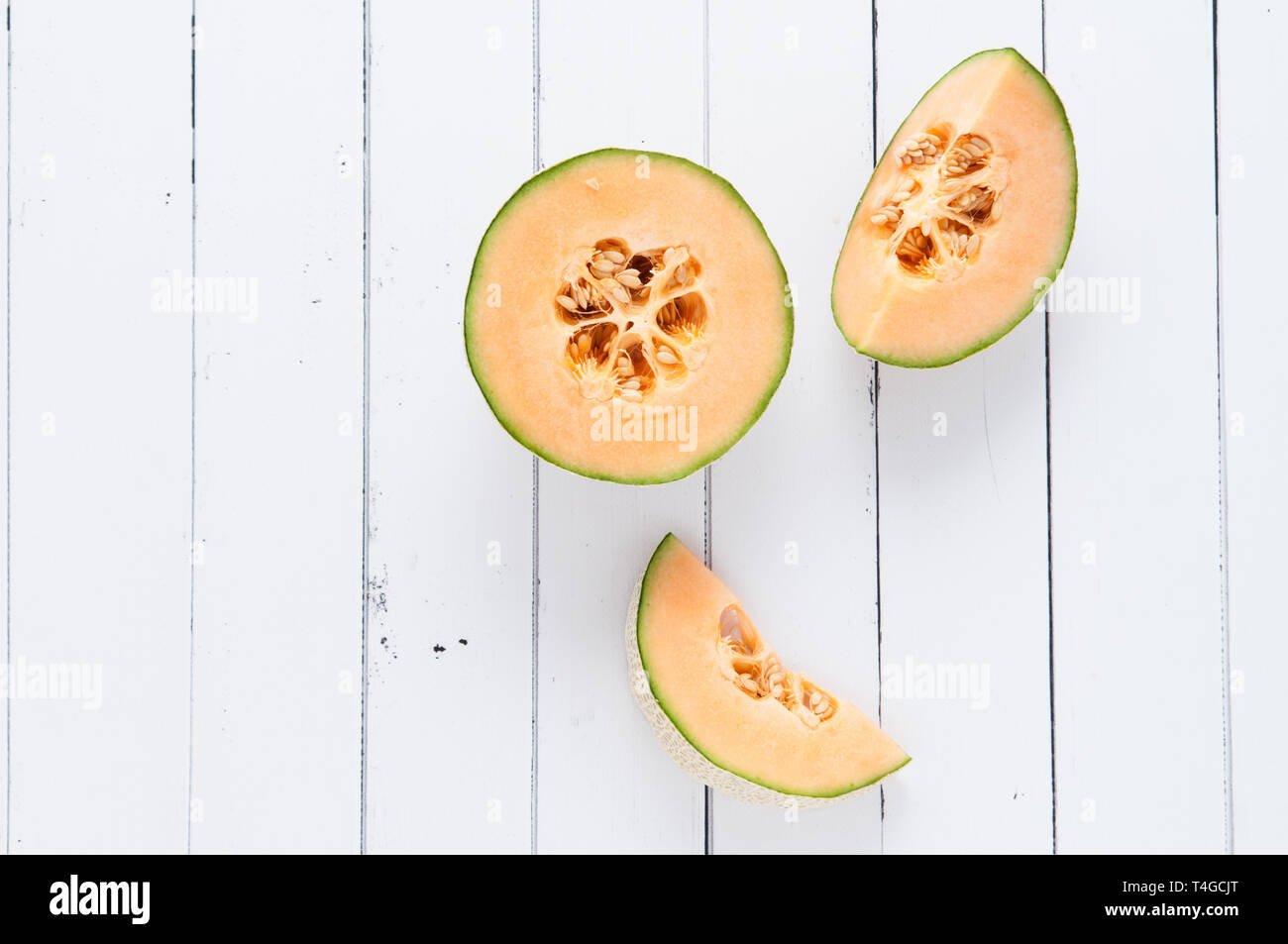cantelope melon on a white wooden background Stock Photo