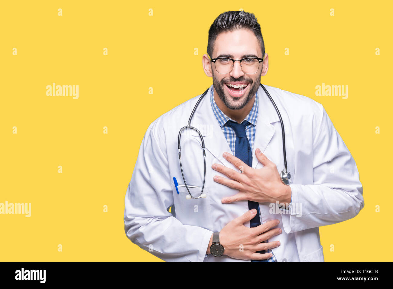 Handsome young doctor man over isolated background Smiling and laughing  hard out loud because funny crazy joke. Happy expression Stock Photo - Alamy