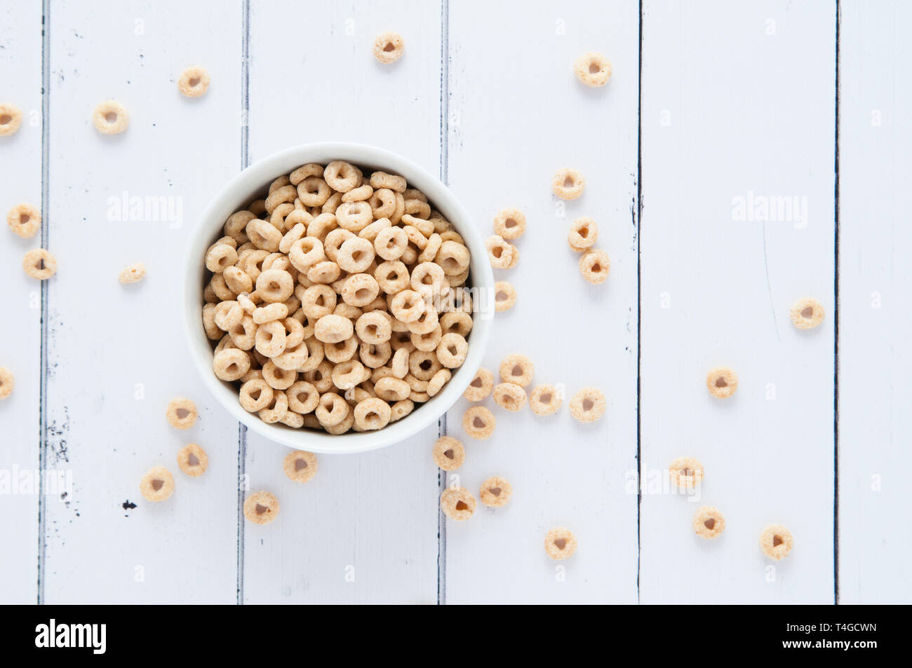 breakfast cereal in a bowl on a white wooden table Stock Photo