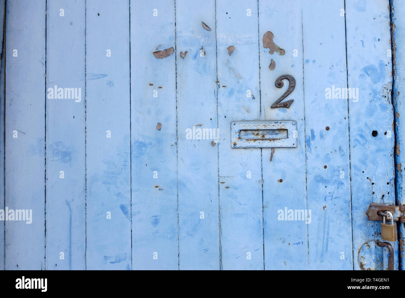 Painted Pale Blue Wooden Double Garage Doors With Padlock Stock