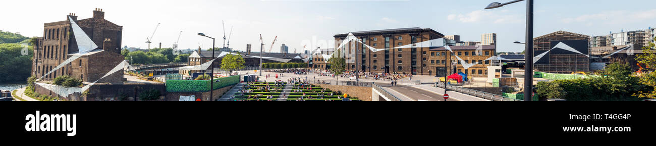 Panoramic image of a silver foil art installation covering the old railway and goods buildings around Granary Square, King's Cross, London, UK, 2013 Stock Photo