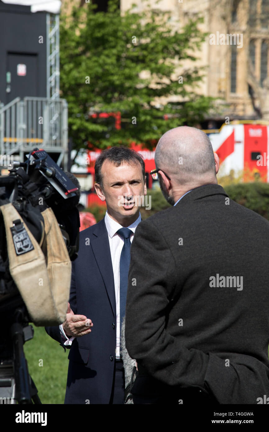 Westminster, London, UK. 11 April 2019. Alun Cairns, Secretary of State for Wales, gives a number of interviews to the media in College Green opposite Stock Photo