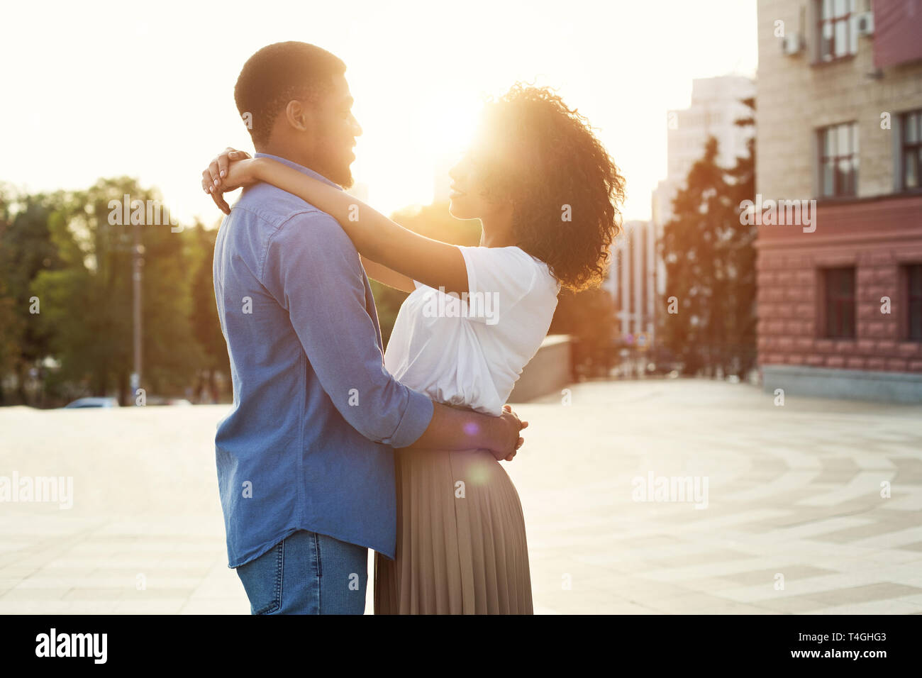 Couple in love having romantic tender moments at sunset Stock Photo