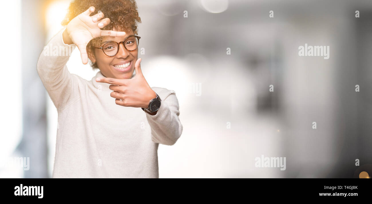 Beautiful young african american woman wearing glasses over isolated ...