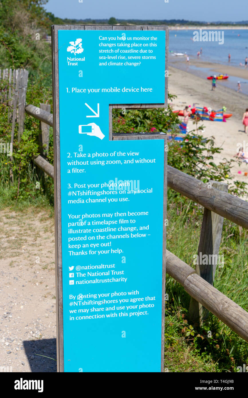 Sign encouraging visitors to photograph a shoreline which can then be made into a timelapse, Middle Beach, Studland Bay, Isle of Purbeck, Dorset, UK. Stock Photo