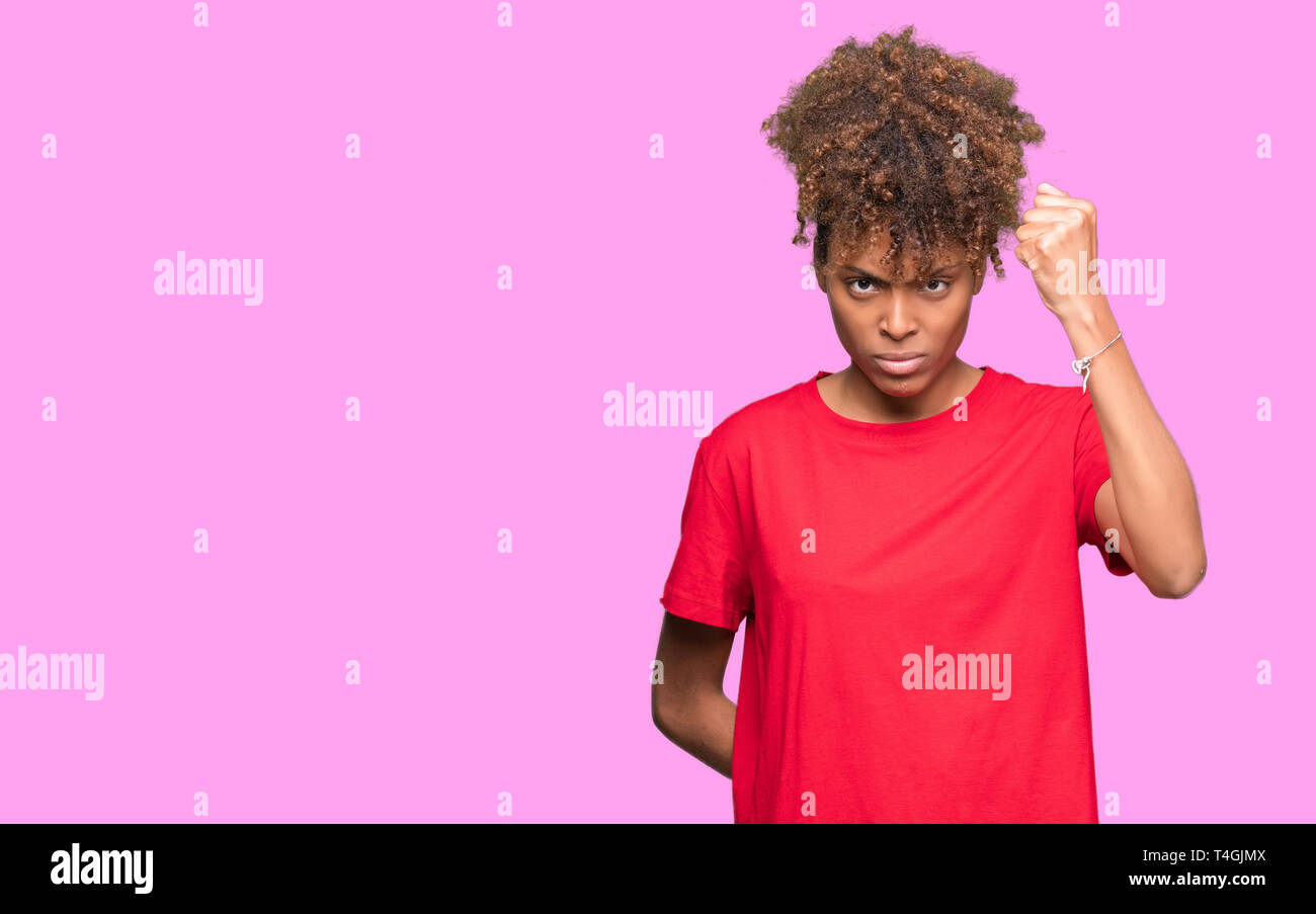 Angry young woman raising hand hi-res stock photography and images - Alamy
