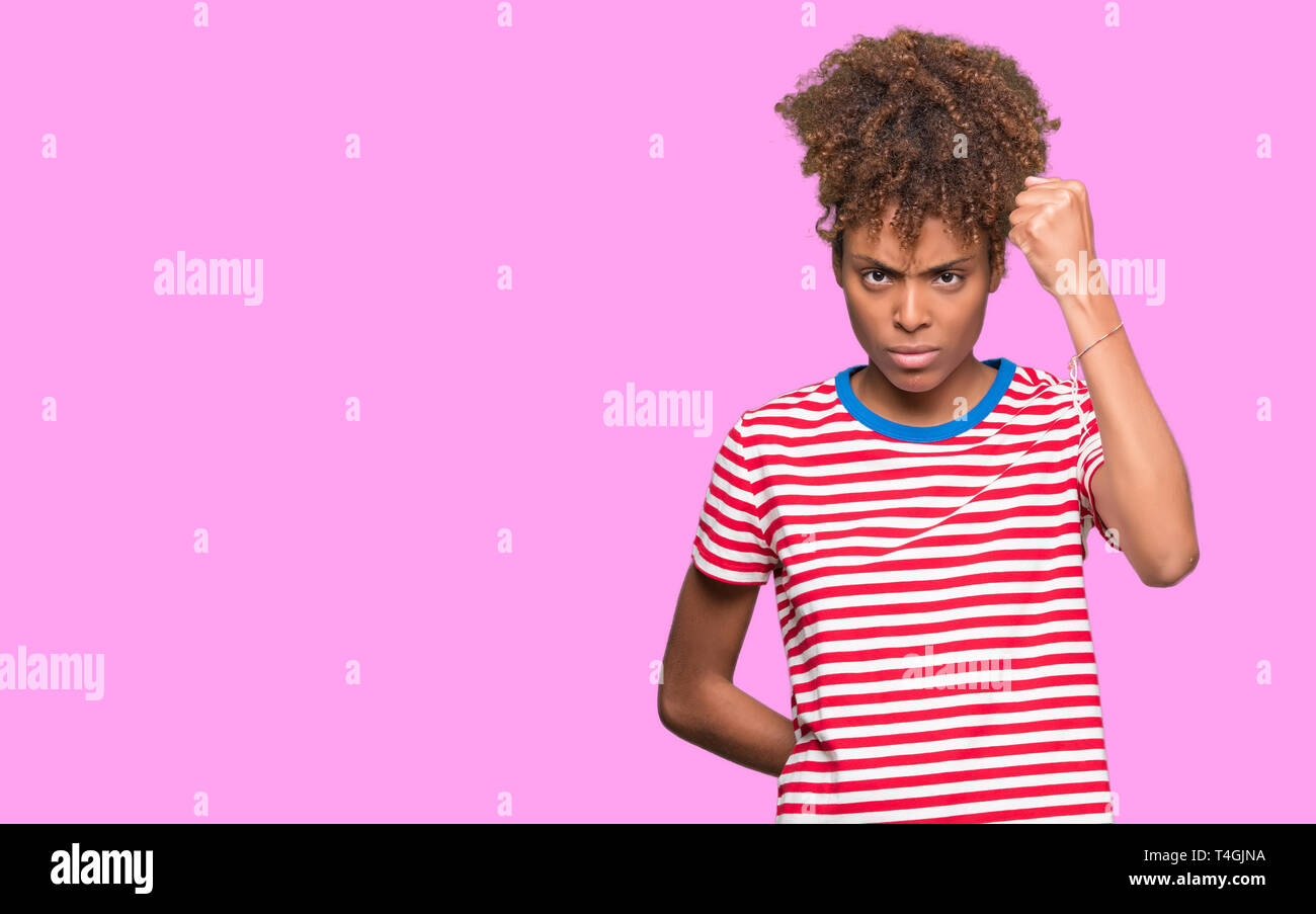 Angry young woman raising hand hi-res stock photography and images - Alamy