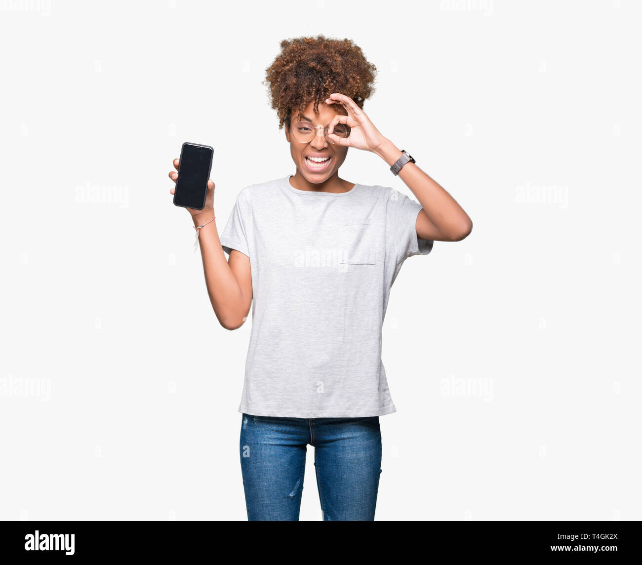 Young african american woman showing smartphone screen over isolated ...