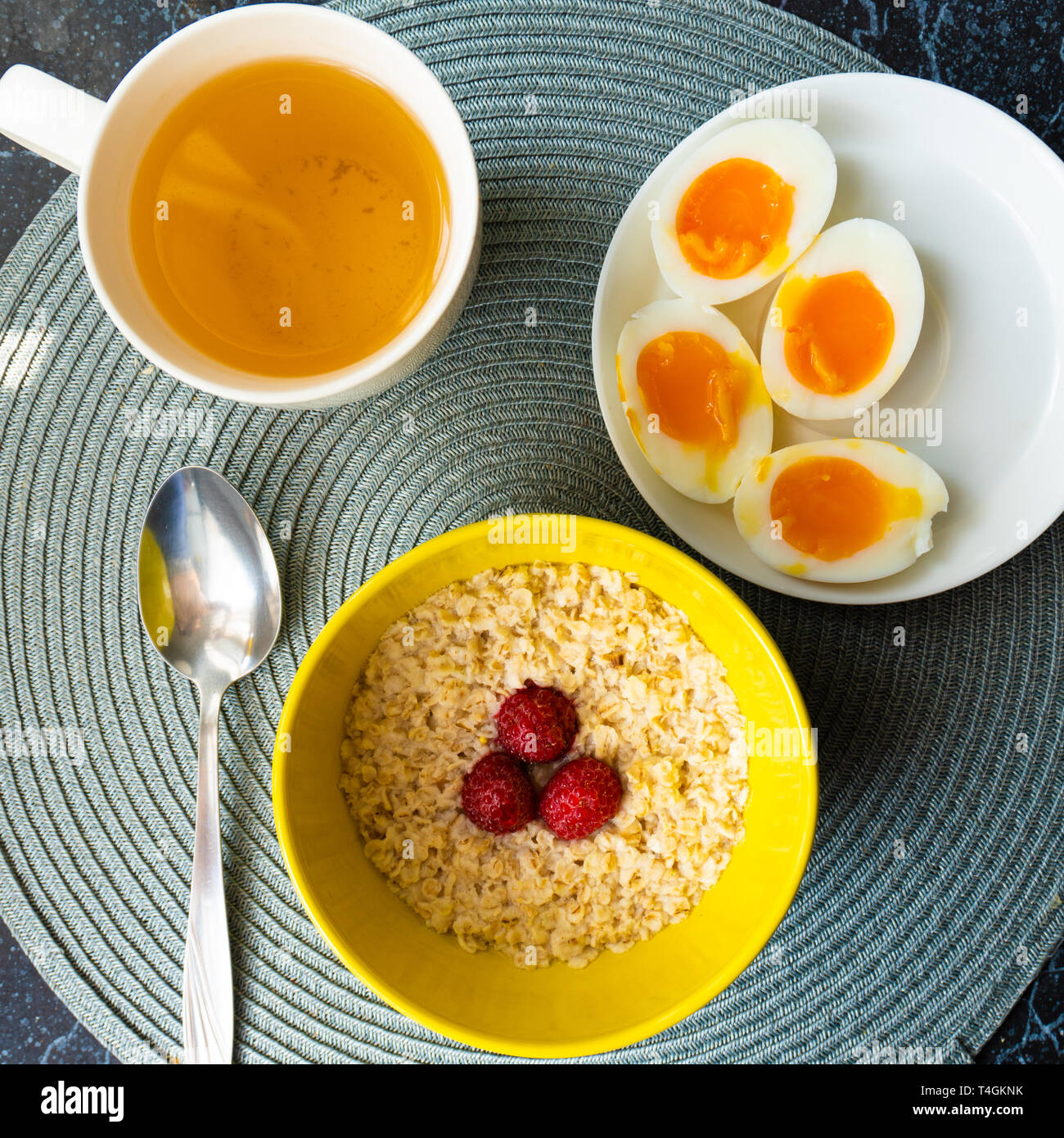 Top view of healthy cereal oat with boiled eggs at breakfast Stock