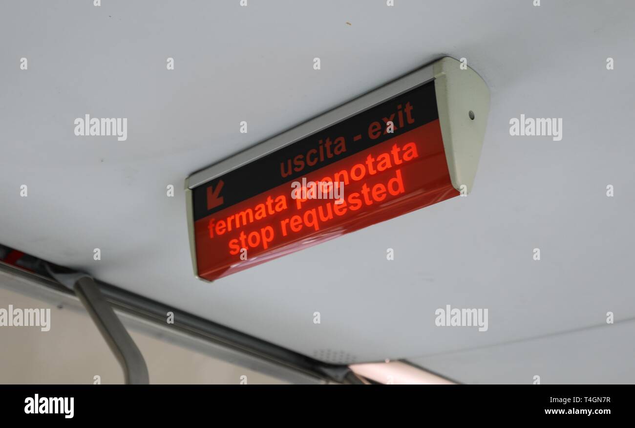 light signal with italian text FERMATA PRENOTATA that means Stop request in italian language on the tram of the italian  city Stock Photo