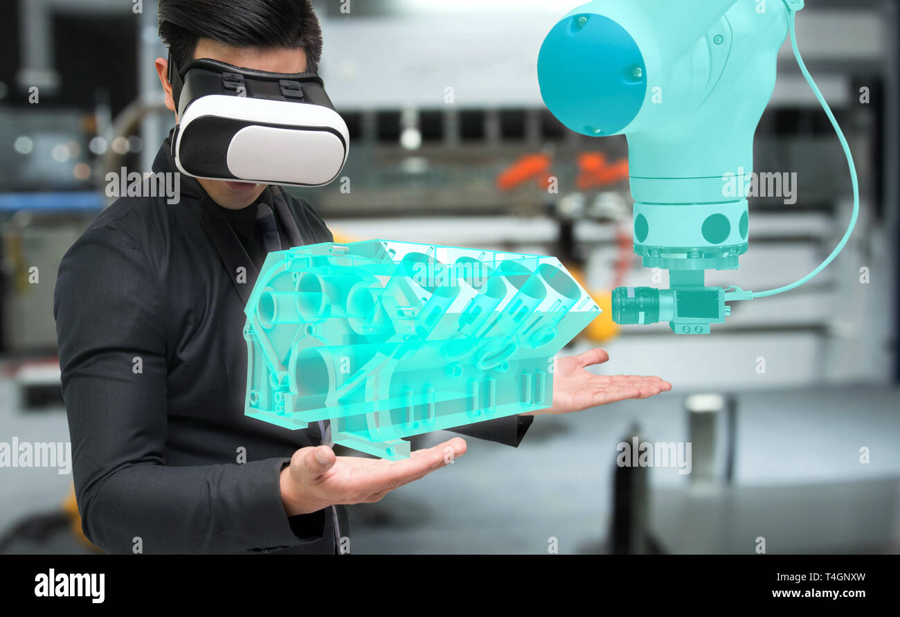 Virtual reality technology in industry 4.0. Business man suit wearing VR glasses to see AR service , Machine camera vision of smart robot arm machine  Stock Photo