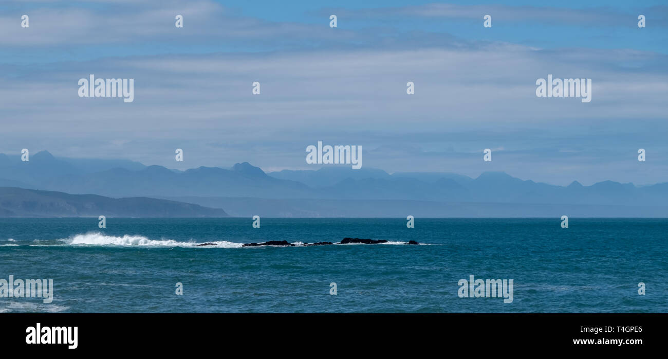 Rocks and sea on a calm day, photographed from the Beacon Island Hotel, Plettenberg Bay, Garden Route, South Africa Stock Photo