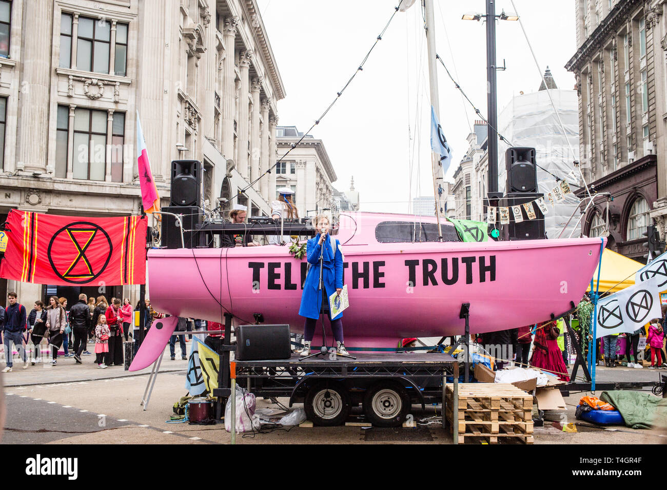 London UK 16th Apr 2019  A Woman speaks in front of boat  with'Tell The Truth' written on  Oxford Street. Stock Photo