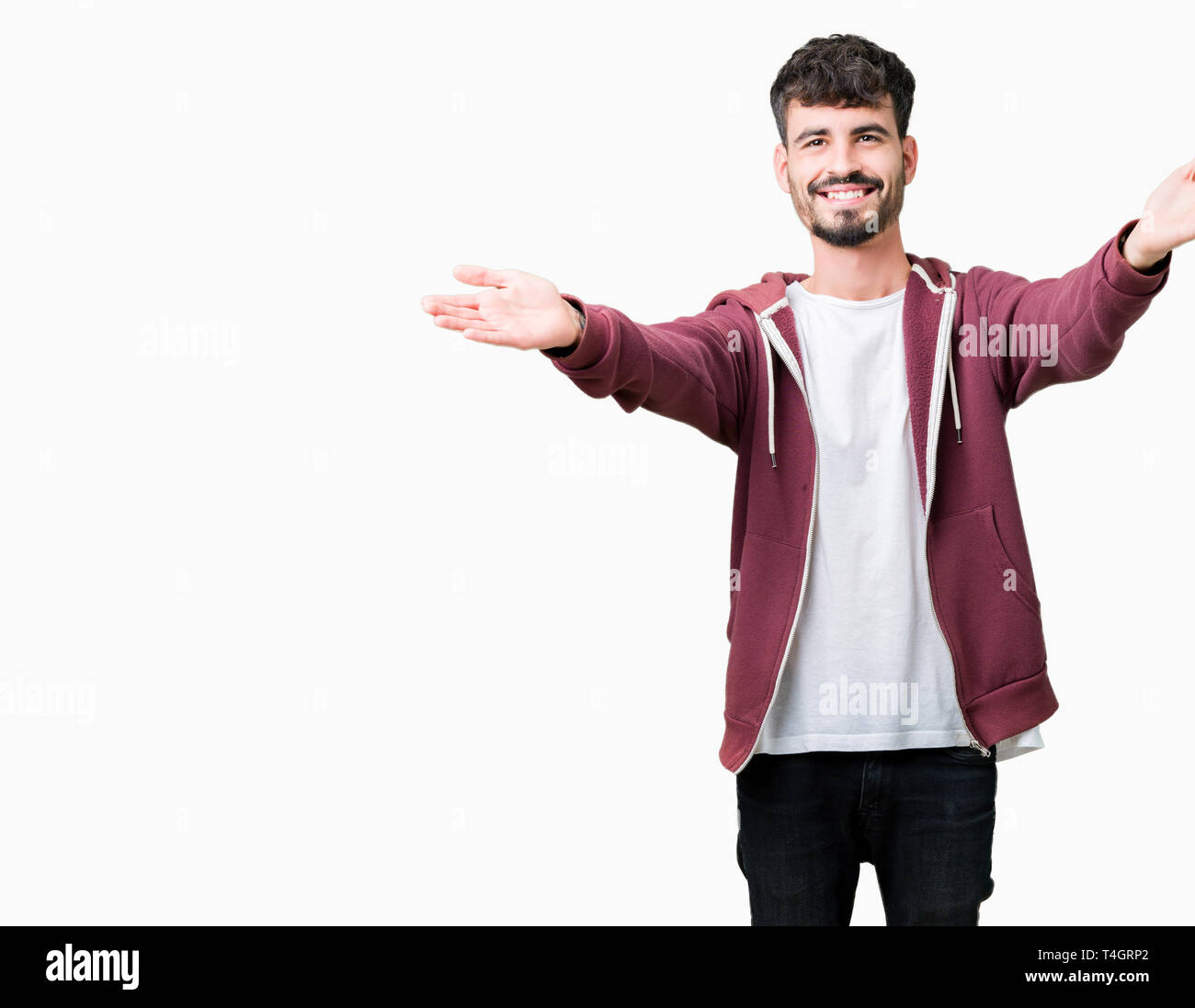 Young Handsome Man Over Isolated Background Looking At The Camera Smiling With Open Arms For Hug Cheerful Expression Embracing Happiness Stock Photo Alamy