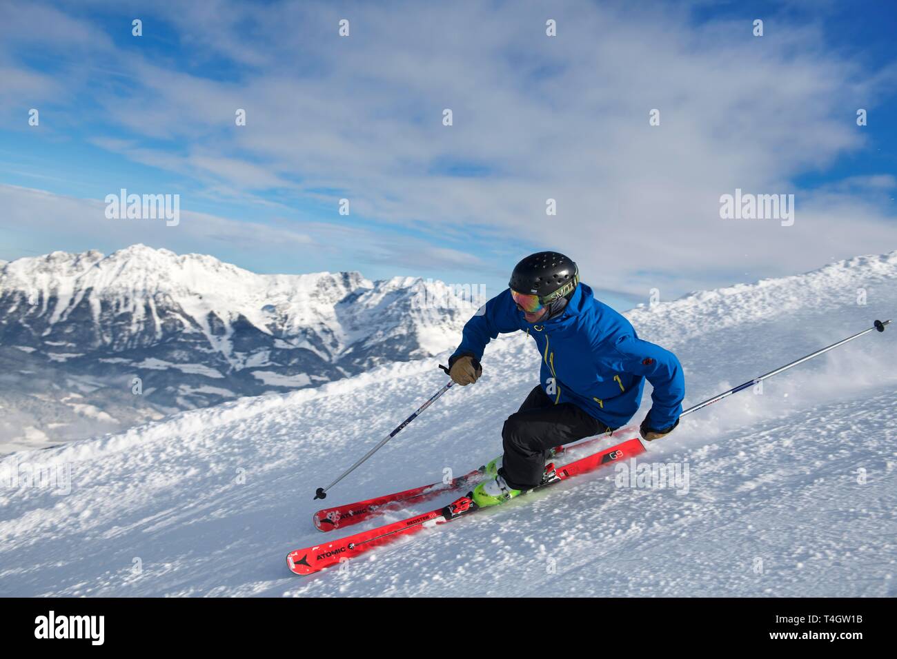 Young skier with sporty style of skiing at the descent from the Hohe Salve, Hopfgarten, Tyrol, Austria Stock Photo