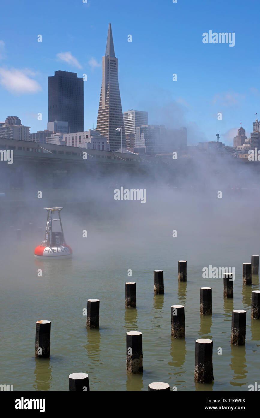 The Exploratorium's manufactured fog wafts over the bay waters with the city's iconic skyline in the background. Stock Photo