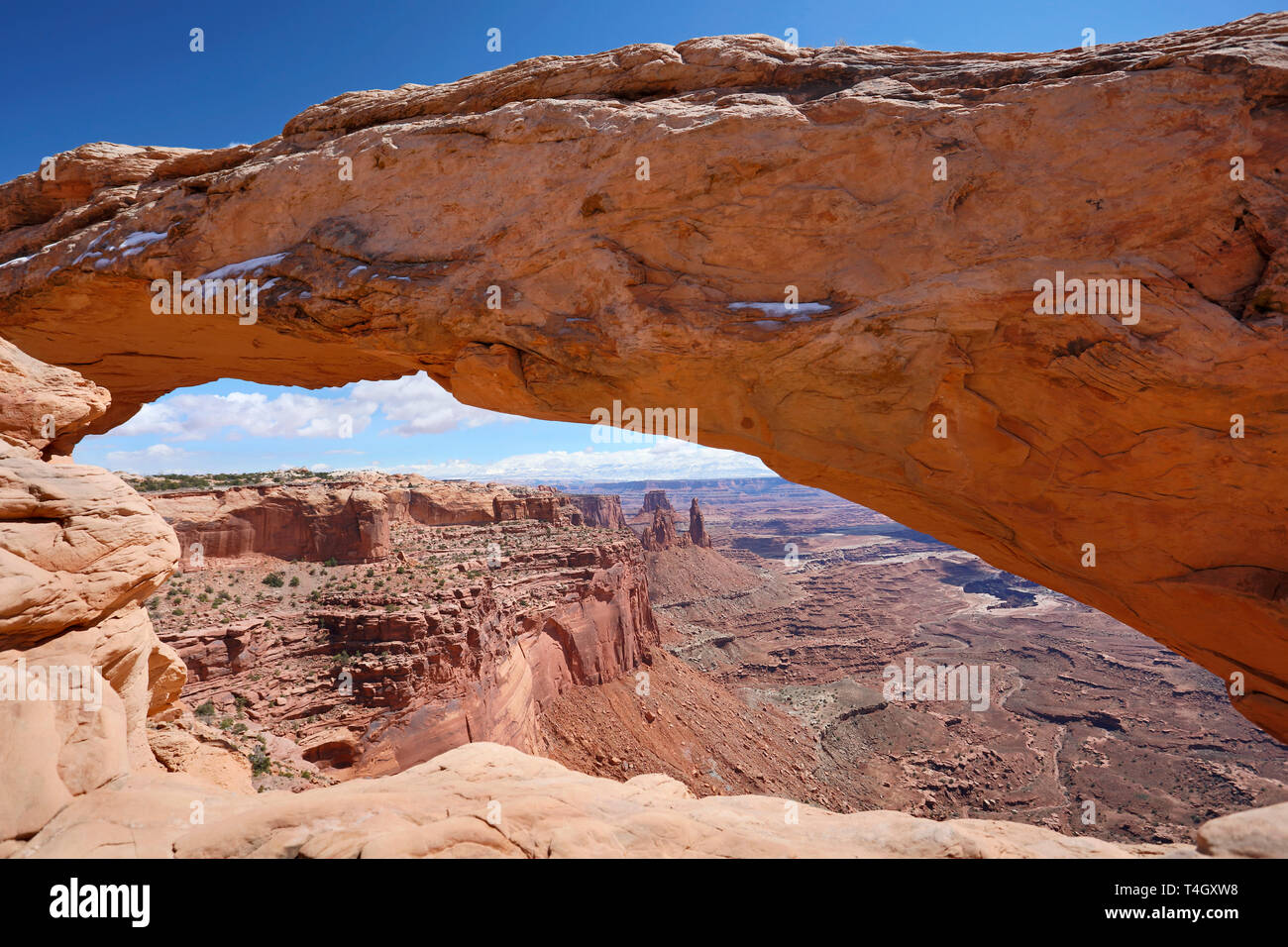 Panoramic view through the Mesa Arch of the Canyonlands Nation Park, Moab, Utah. Stock Photo