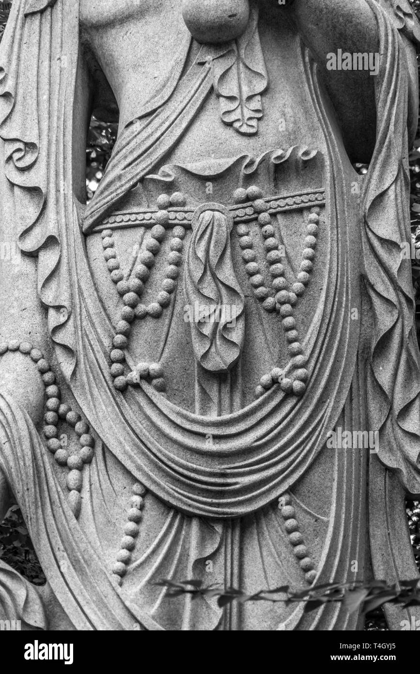 Minato-ku, Tokyo - August 11, 2017 : Caving details of Sho Kannon statue Principal incarnation of Avalokiteshvara, the bodhisattva of compassion at Zo Stock Photo