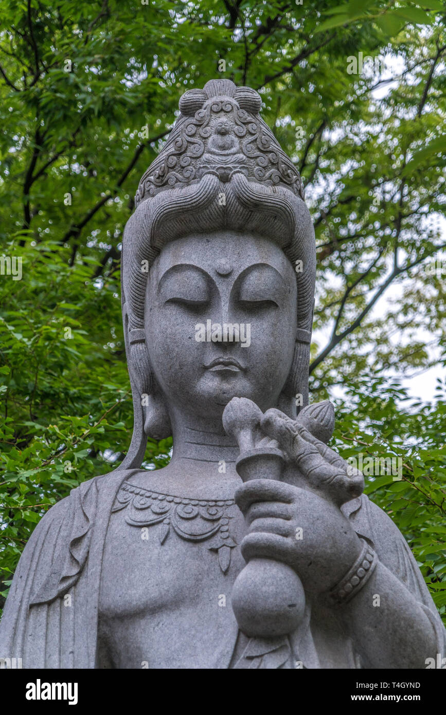 Minato-ku, Tokyo - August 11, 2017 : head detail of Sho Kannon statue. Principal incarnation of Avalokiteshvara, the bodhisattva of compassion at Zojo Stock Photo