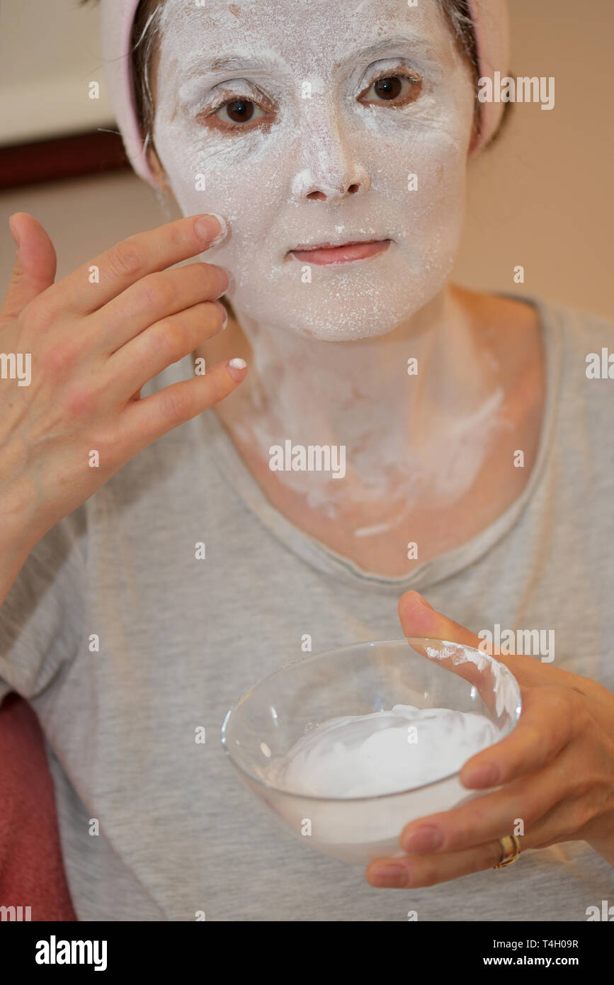 Woman applying pearl powder facial mask Stock Photo Alamy
