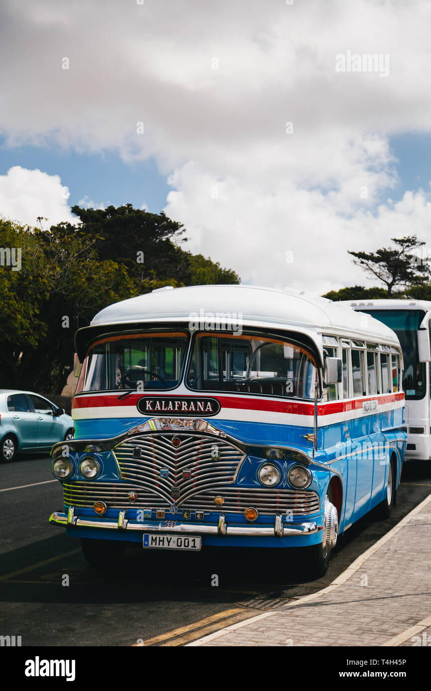 MDINA, MALTA - SEPTEMBER, 15 2018: A typical colorful old Maltese British bus from the 60s at the street, public transport in Malta Stock Photo