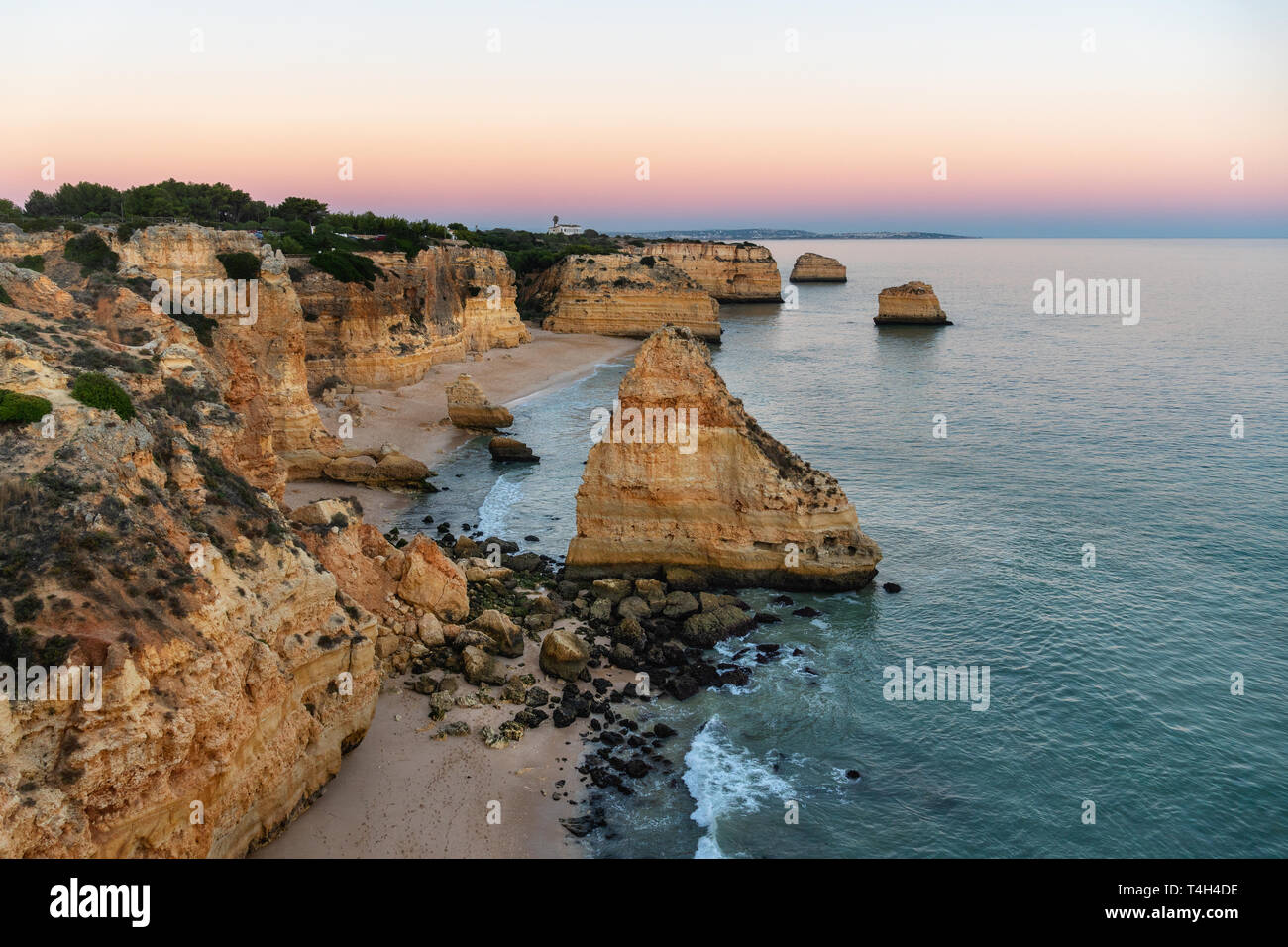 Amazing seascape at sunset at Marinha Beach in the Algarve, Portugal. Landscape with strong colors of one of the main holiday destinations in europe. Stock Photo