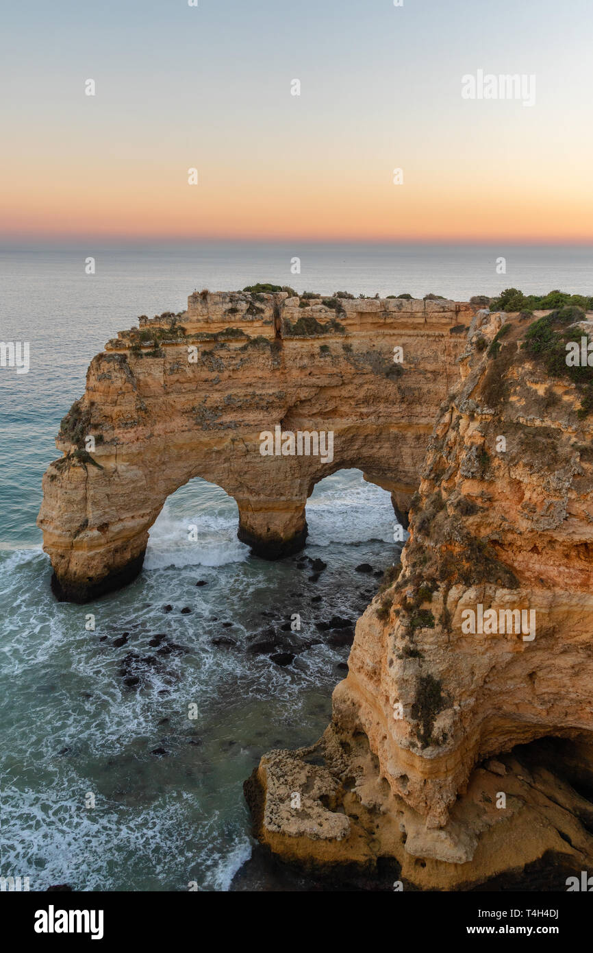 Amazing seascape at sunset at Marinha Beach in the Algarve, Portugal. Landscape with strong colors of one of the main holiday destinations in europe.  Stock Photo